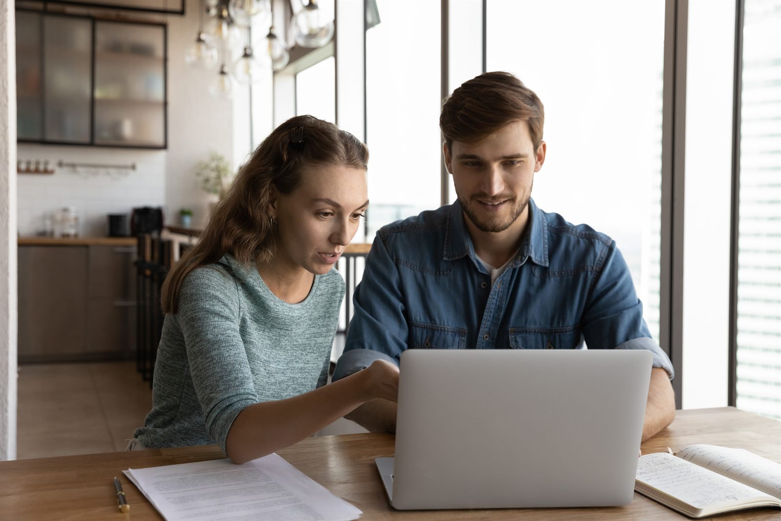A business owner reviewing personal and business tax documents