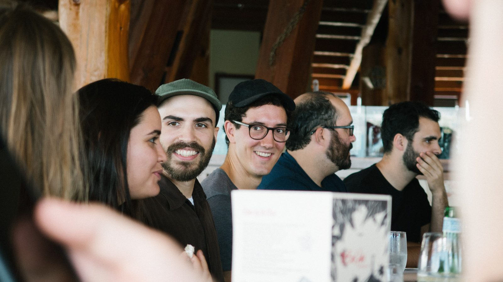 A group of colleagues talking together around a table